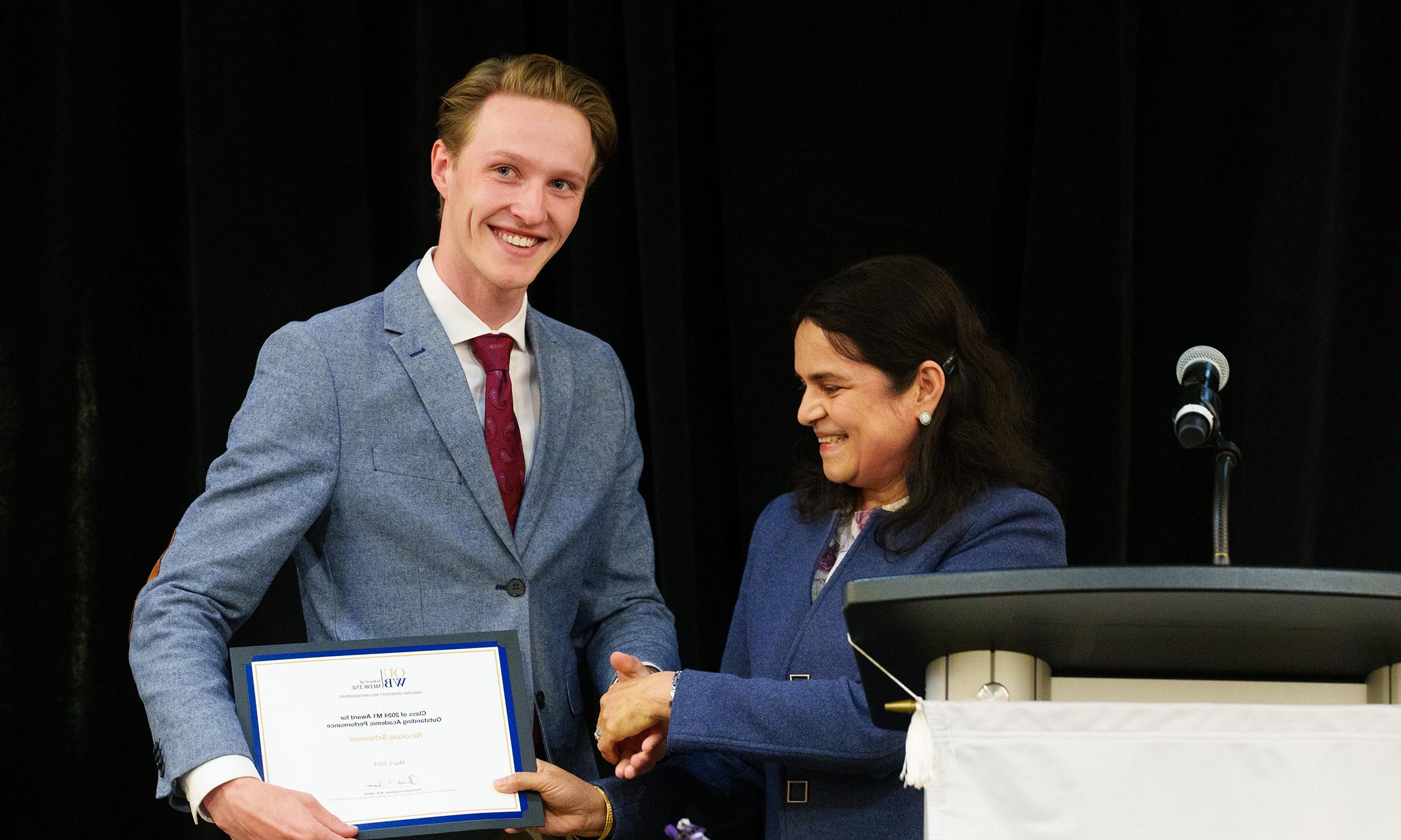 An image of a student receiving an award